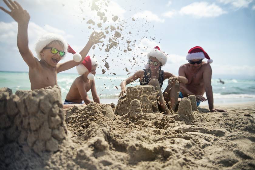 family on beach at christmas