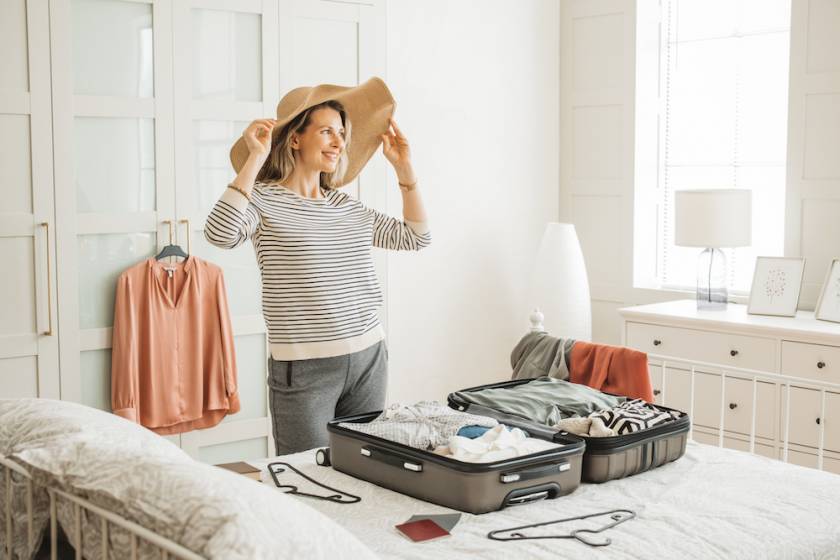 Woman packing for beach trip